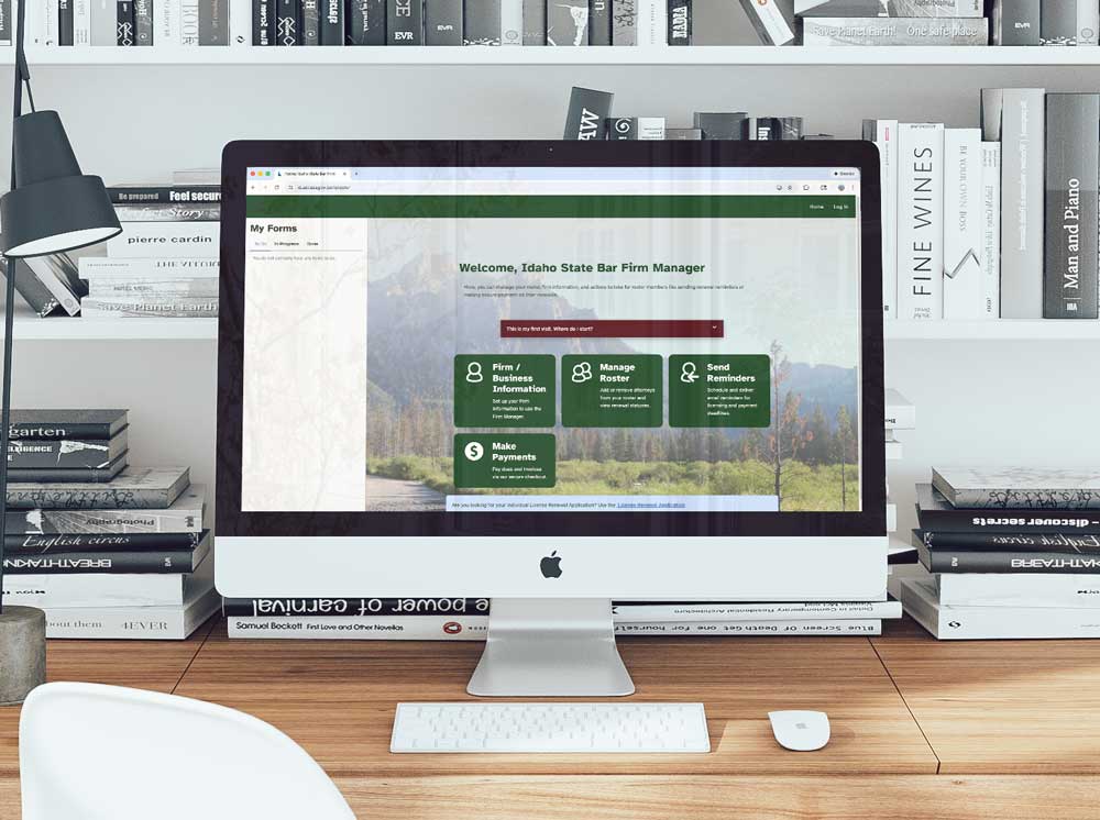 state bar firm renewal website on imac desktop with books behind