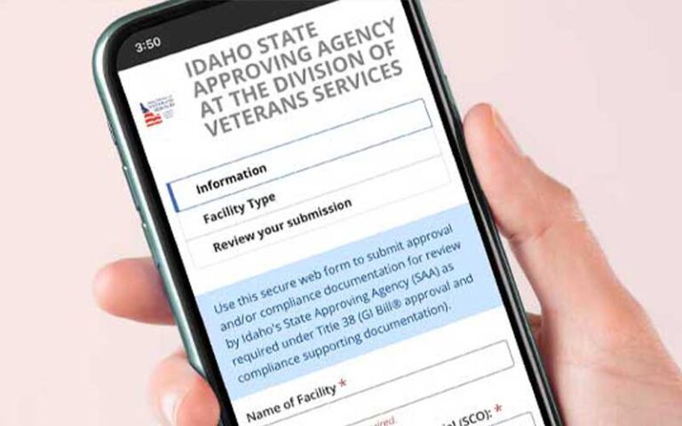 hand holding phone with Idaho Division of Veteran Services application on it