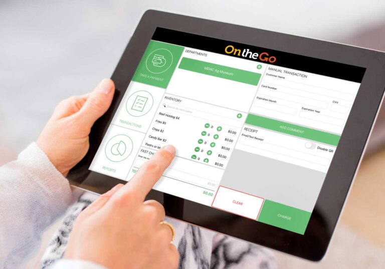 person holding ipad with OnTheGo Pay screen on it